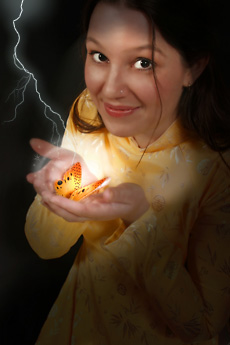 girl holding butterfly with lightening in background
