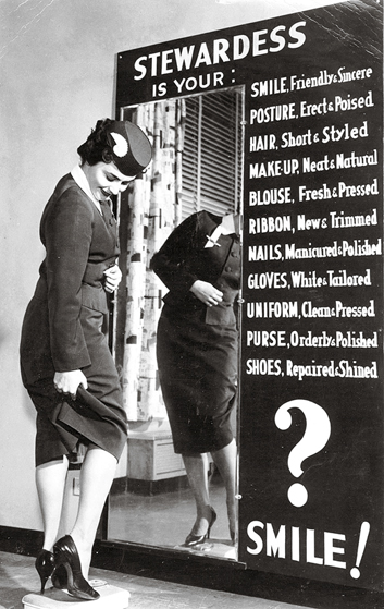 Stewardess checking uniform